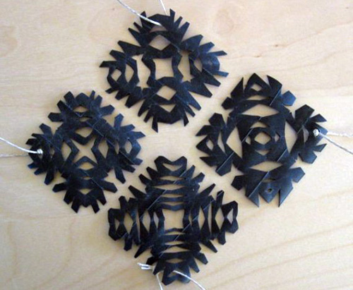 Showflake ornaments made from bike inner tubes
